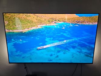 Vizio 75-inch Smart 4K TV with wall mount and entertainment system