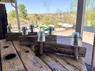 1957 eclectic insulators attached to wood post and wires 