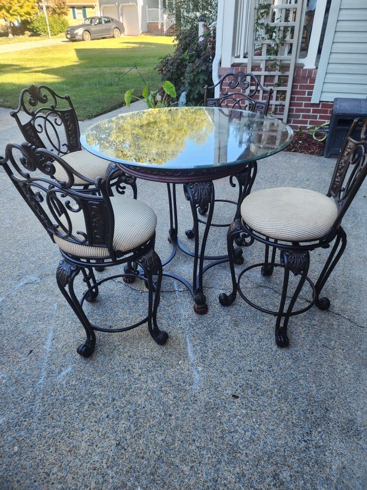 40″ Ashley Furniture Bronze and Glass Table and Swivel Chairs