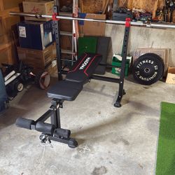 Weight Lifting Bench With Barbell And Weights
