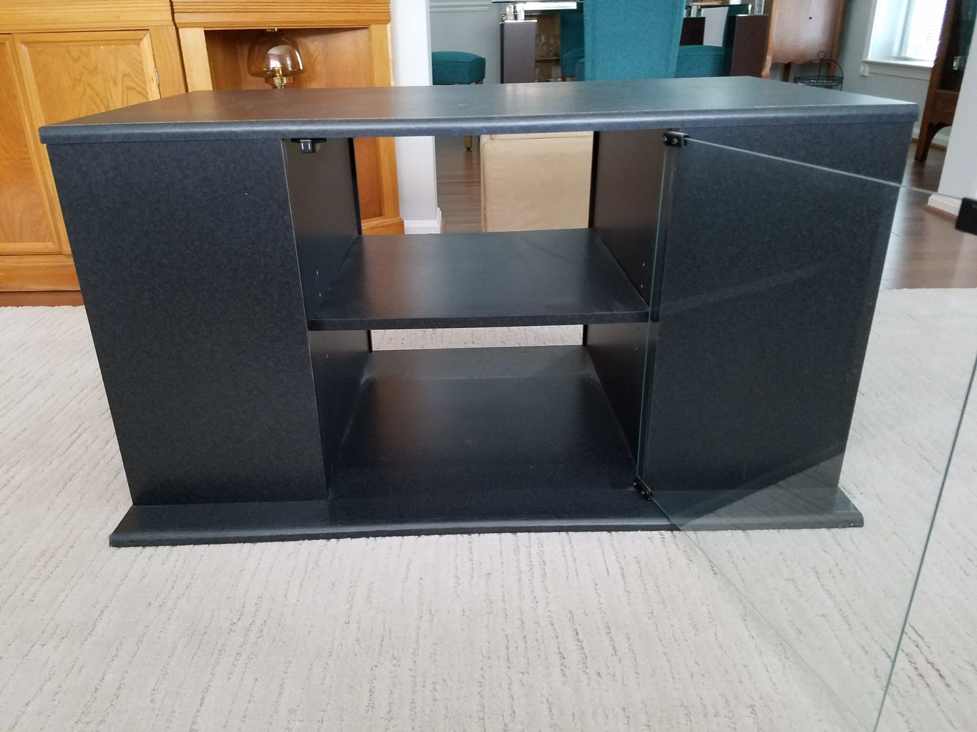 TV stand with adjustable side and center shelves with glass doors