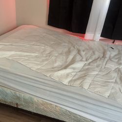 Twin bed with boxspring and rails