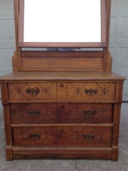 Late 18th century country style dresser with swivel mirror and three spoon carved drawers