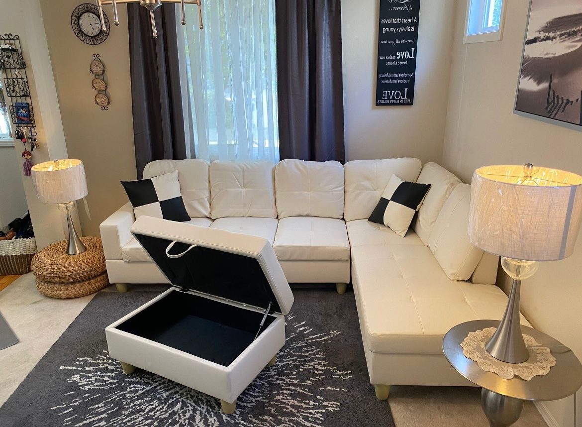 New White Leather Sectional Sofa With Storage Ottoman And Pillows 