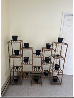 Wooden plant stands with pots