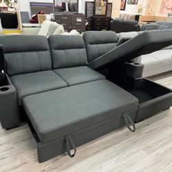 Black fabric sleeper sectional sofa chaise with storage arm and cup holder 

