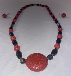 vintage Chinese cinnabar and black onyx necklace and earrings set.