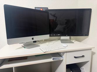 Apple iMac desktop with monitor, keyboard and mouse