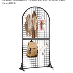 Brand new rolling and folding display wall or display grid with 20 hooks 6’1“ x 32“ wide