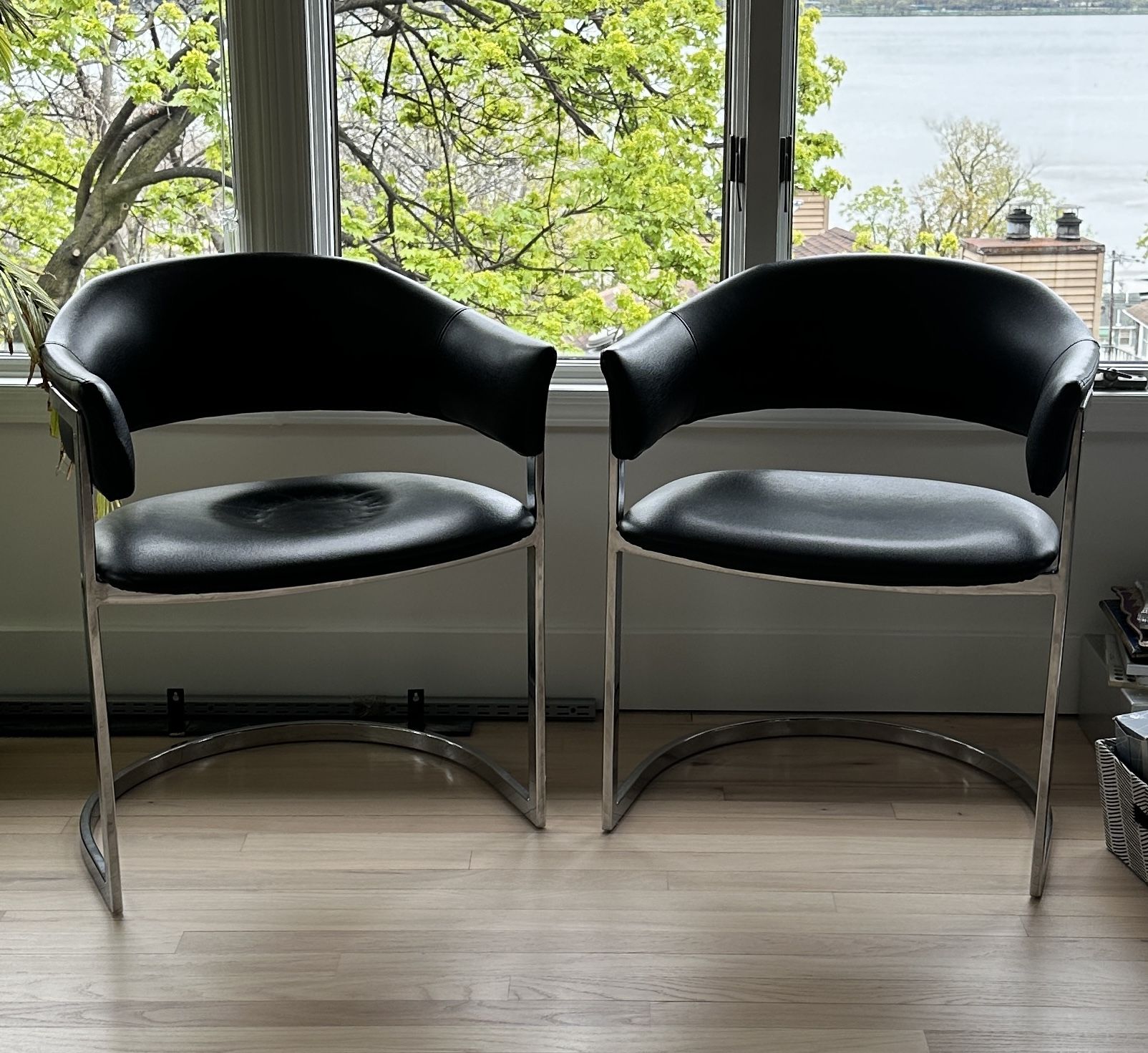 2 modern black leather chairs 