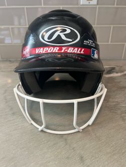 Rawlings Vapor T-Ball batting helmet with face guard.