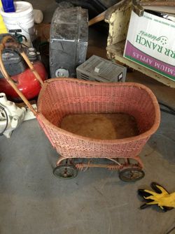 Great pink wicker baby buggy