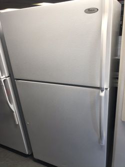 Used whirlpool top and bottom fridge. 1 year warranty
