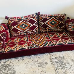 A matching set of curtains, floor mats , and sofa cushions.