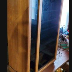 stereo cabinet has tinted glass and wheels can handle a lot of weight 