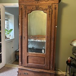 Antique French armoire wardrobe with bow and ribbon details