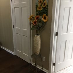 Tall velvet felt sunflowers in mosaic vase with plant stand