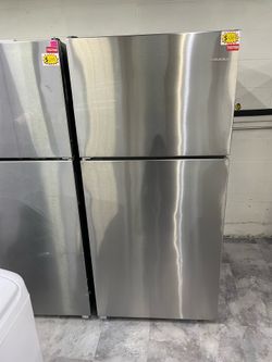 Amana refrigerator top and bottom in stainless steel