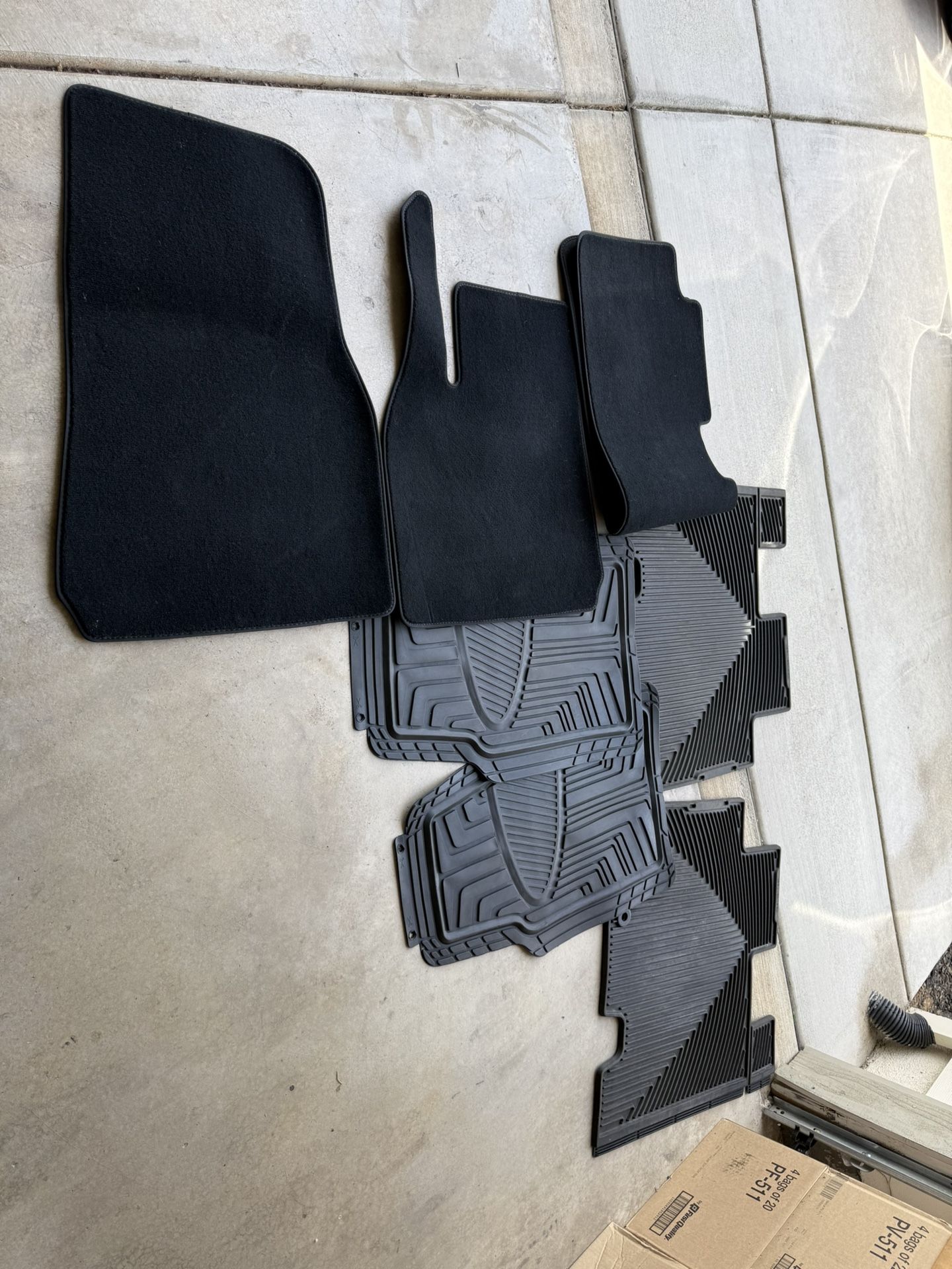 Assorted auto floor mats.