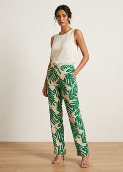 H&M Green palm leaf print pants on beige background #tropical #summer