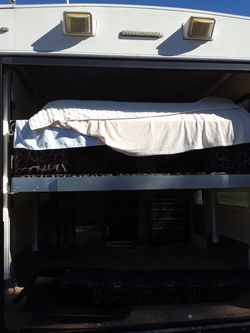 Power beds for an RV toy hauler