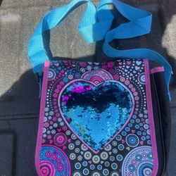 Purse pink trim and teal handle, sequined heart on front
