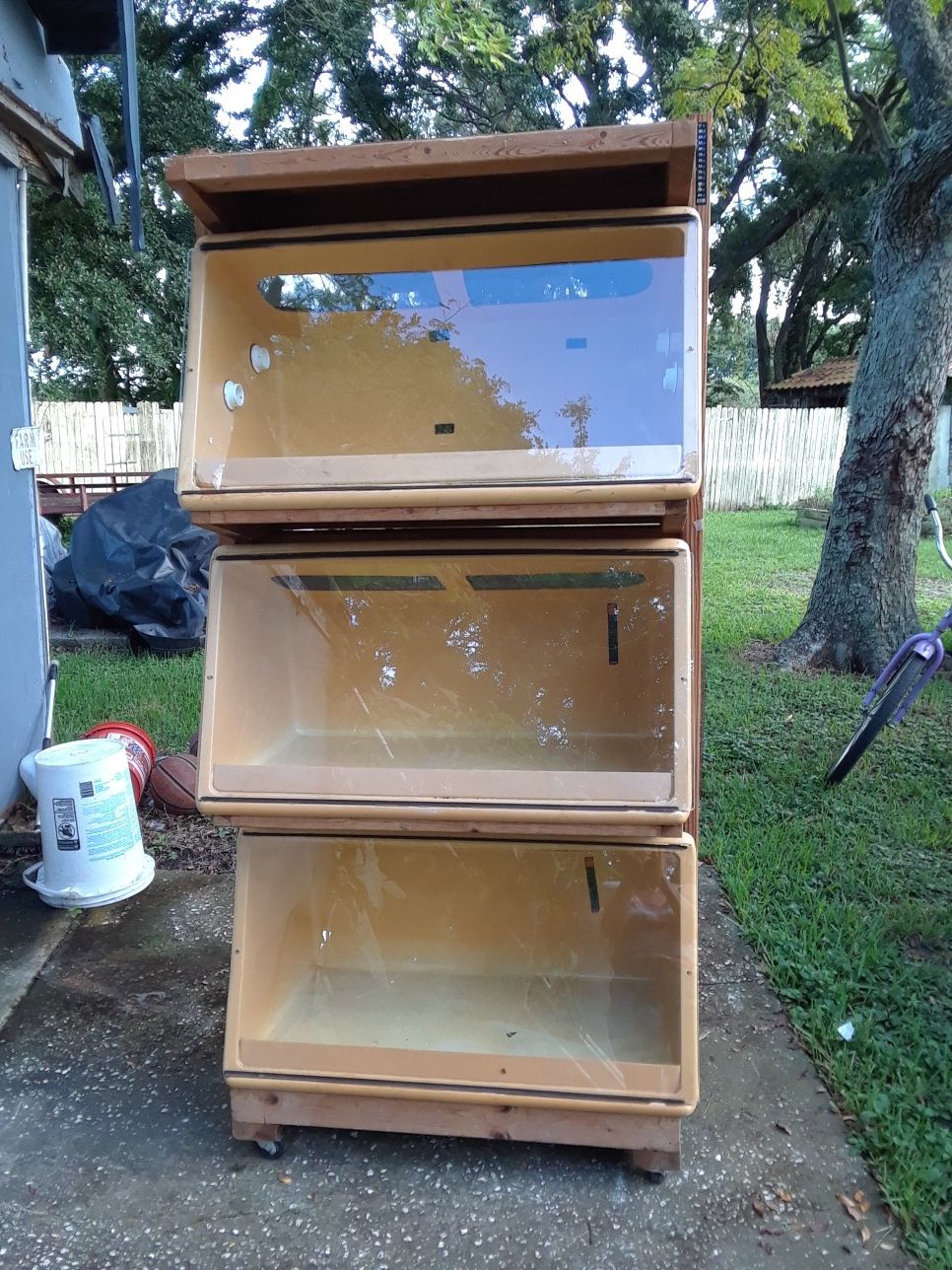 Reptile neodesha plastic cages. 3 cages can be removed from stand.6ft. Tall on wheels. SLiding glass doors. One big hot rock included.