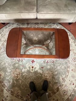 SOLID WOOD COFFEE TABLE WITH FOLDIND SIDES AND BEVELED SMOKED GLASS TOP