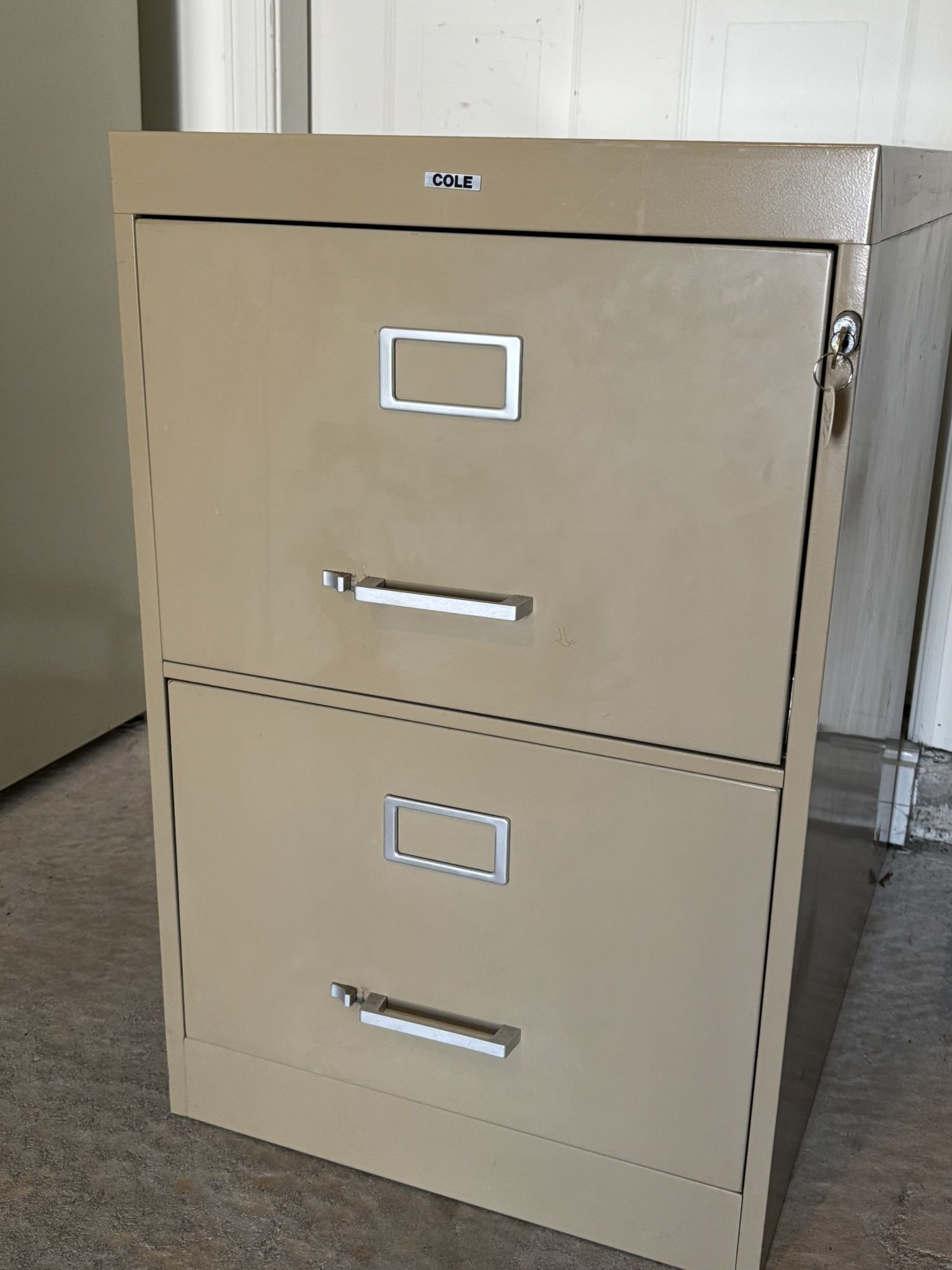 Cole Commercial Grade Vertical File Cabinet 2 Drawer Legal, heavy duty steel construction in excellent condition, color putty with few minor surface i
