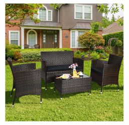 4 pc Rattan patio set with black cushions
