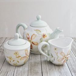 Crate & Barrel Multi-Colored Mint Green Floral Tea Pot, Creamer and Sugar Bowl Matching Set.

Pre-owned in excellent clean condition.  No chips or cra
