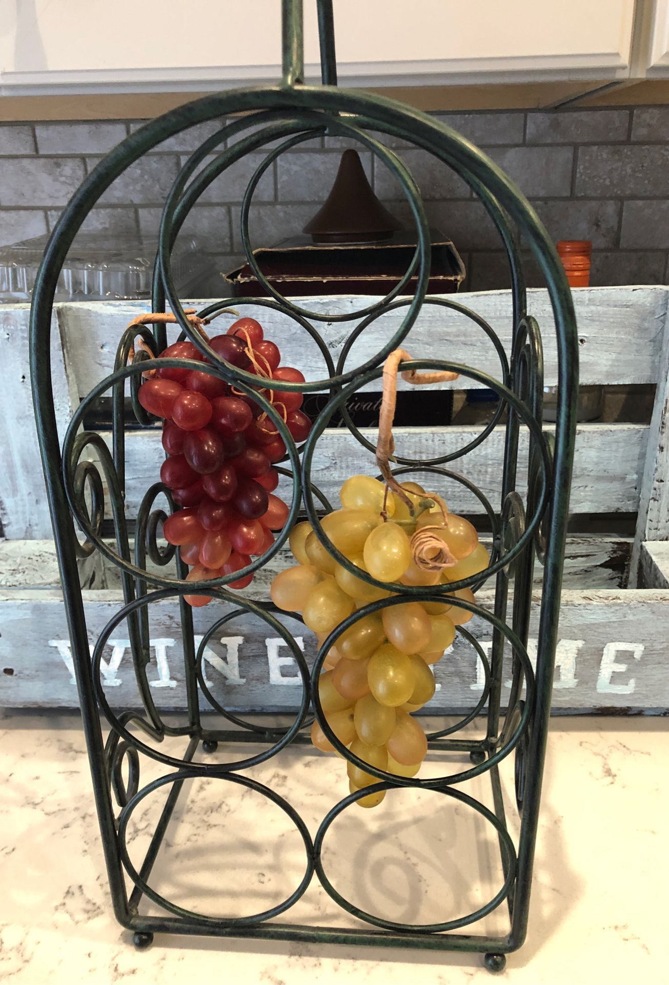 Metal bottle rack wine grapes