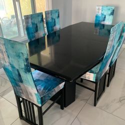 Dining Table  w/ 6 Chairs  Black Marble Style 78x41x29 dimensions 6 chairs and cover is included Chairs has scratches and dings but still in good shap