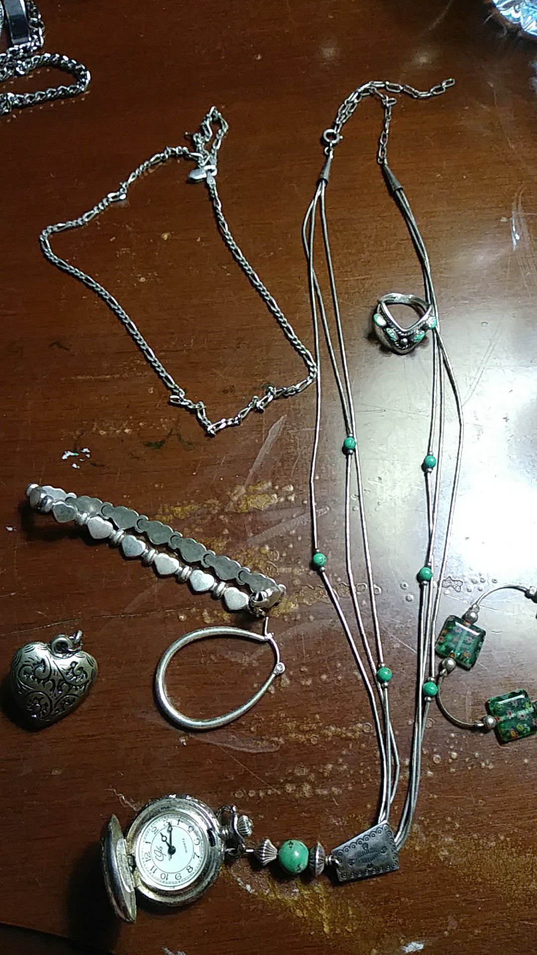 Silver ring , necklace, bracelet ,watch , heart pendant , money clip