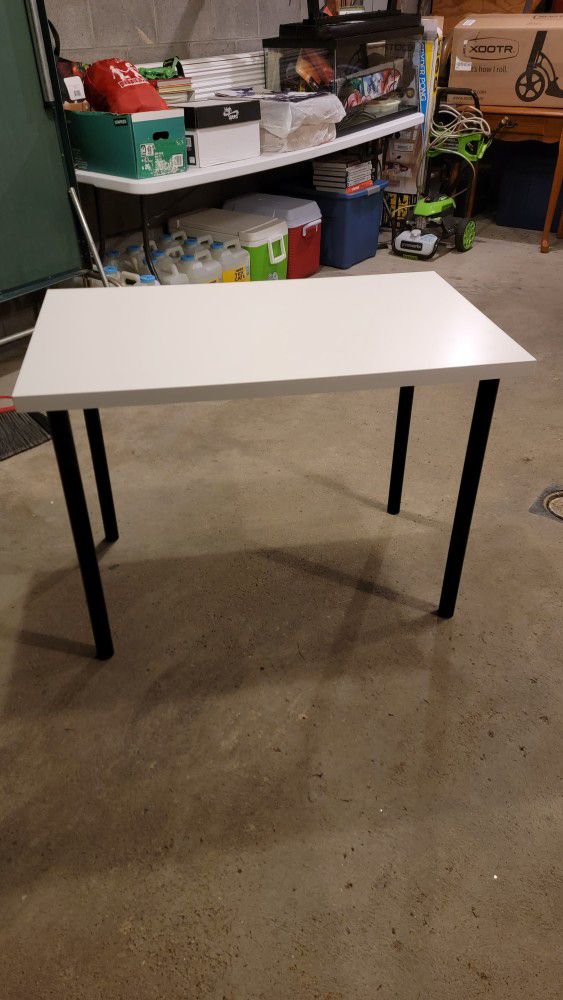 White Table with Black Pole Legs