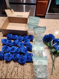 Blue roses with stems and glass gems