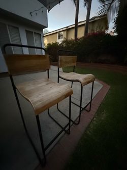 Two modern wooden stools