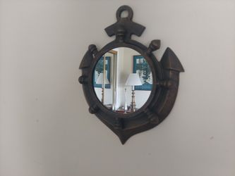 Nautical Theme Mirror Featuring An Anchor and A Ships Wheel Design .