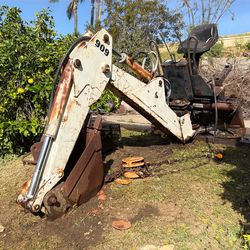 Headline: Bobcat 909 Backhoe Attachment - 3 Bucket Package!