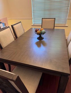 Dining table includes 6 chairs. Extendable
