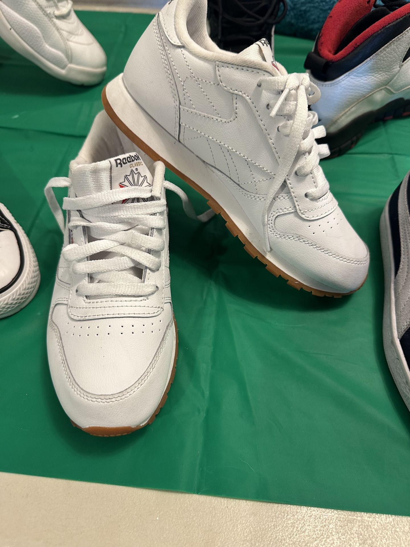 reebok classic leather shoes in white with a gum sole kids