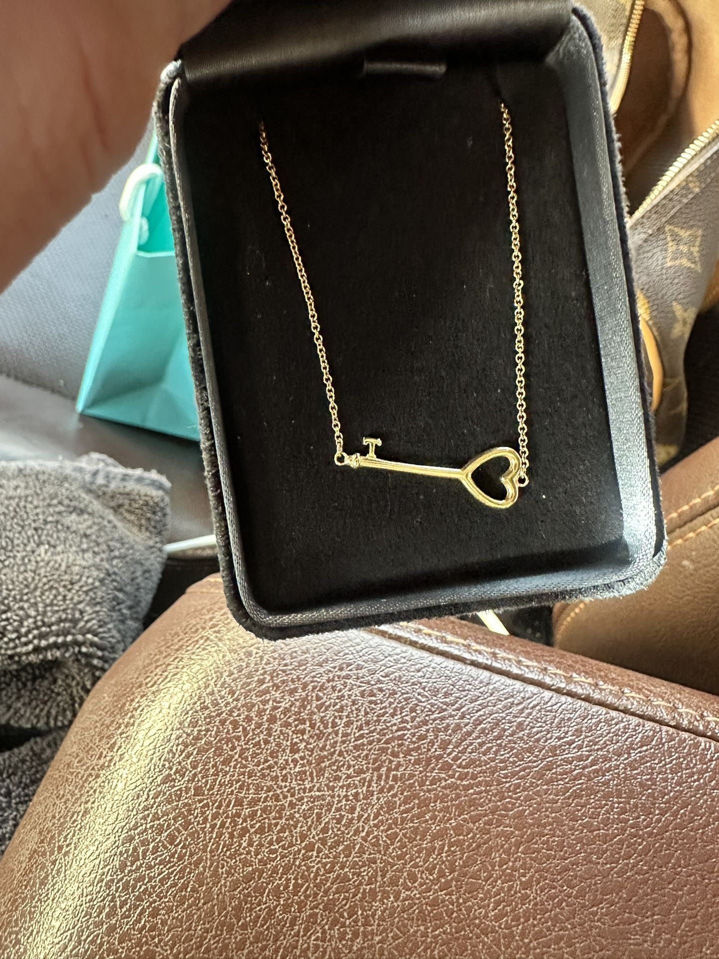 Tiffany’s Gold East-west Key Necklace.