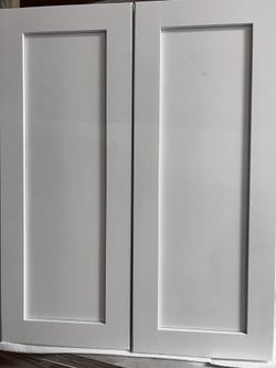 White wooden kitchen cabinets for bathroom and kitchen.