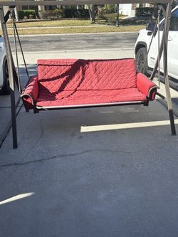 Red Cushion Bench Swing Converts To Bed