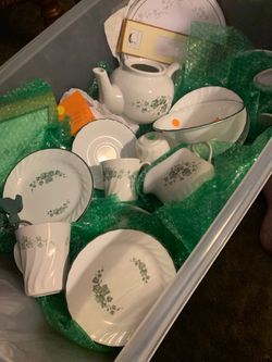Assorted Ivy Corelleware in a tub for viewing