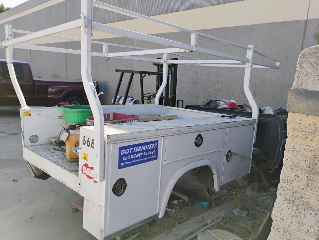 Utility Bed And Ladder Rack. Damaged As Seen In Photos