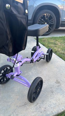 - KNEE scooter  350 lb weight capacity. All Terrain model. Lightly used Shock Absorber/ brand new. Purple color