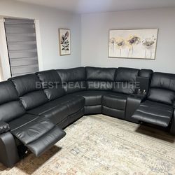 Black faux leather reclining couch