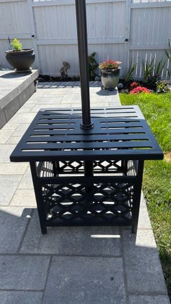 Black cast aluminum umbrella table