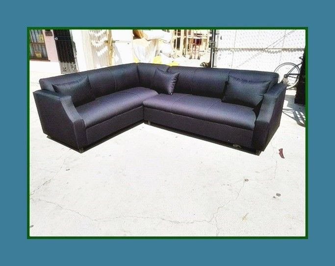 new 7x9 ft "Domino black" sectional couches